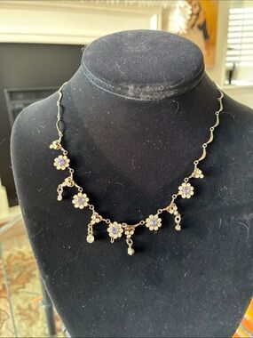 Delicate Gold Flower Necklace with Purple Accents